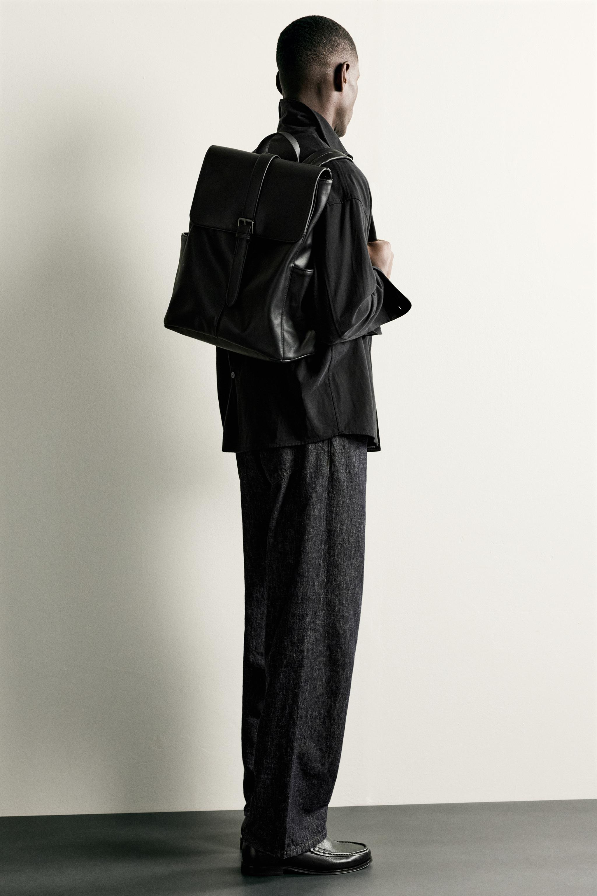 BELTED FLAP BACKPACK